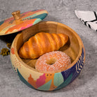Round wooden casserole with tropical design

