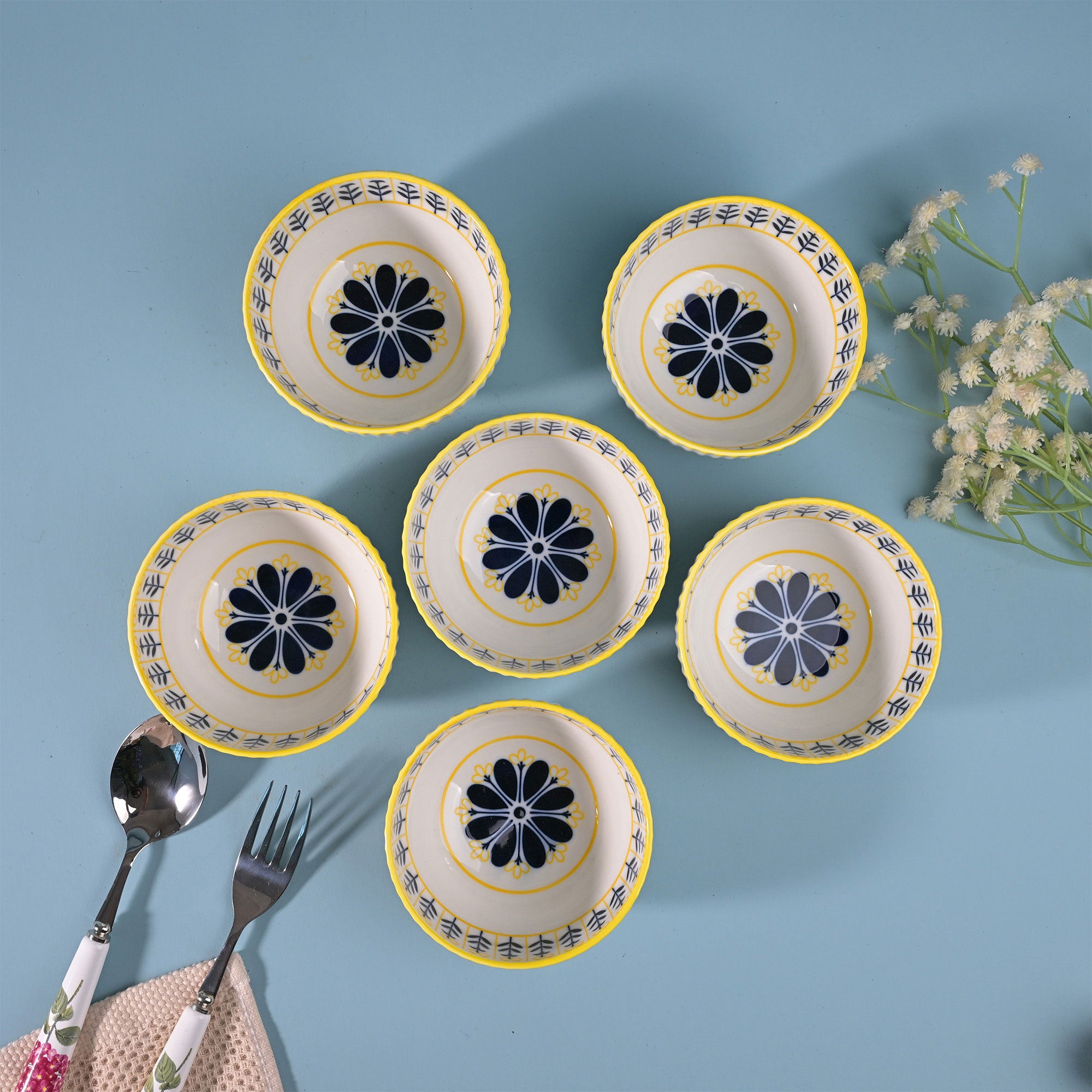 Set of six white porcelain bowls with floral designs

