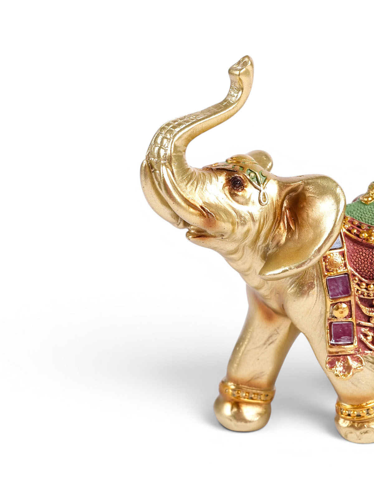 Golden elephant figurine Vaibhav displayed on a tabletop

