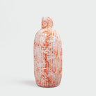 Coral and white patterned vase for home decor

