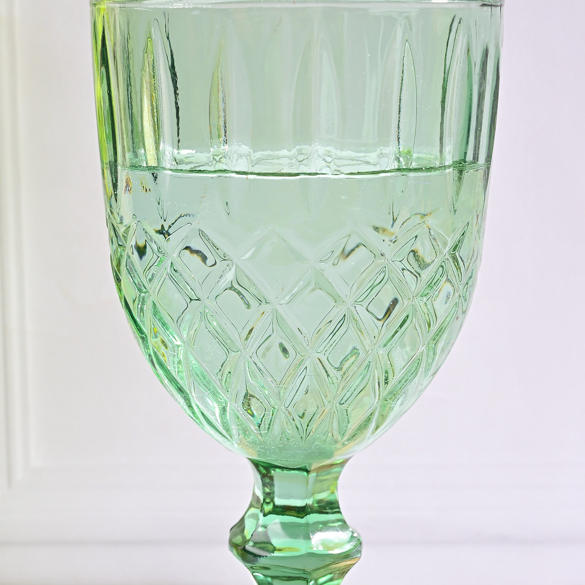 Close-up of diamond detailing on vintage glass



