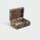 Elegant vintage marble jewelry box featuring elephant patterns

