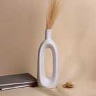 White glossy hollow vase with elegant modern design

