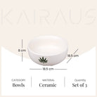 White ceramic bowls with botanical leaf design

