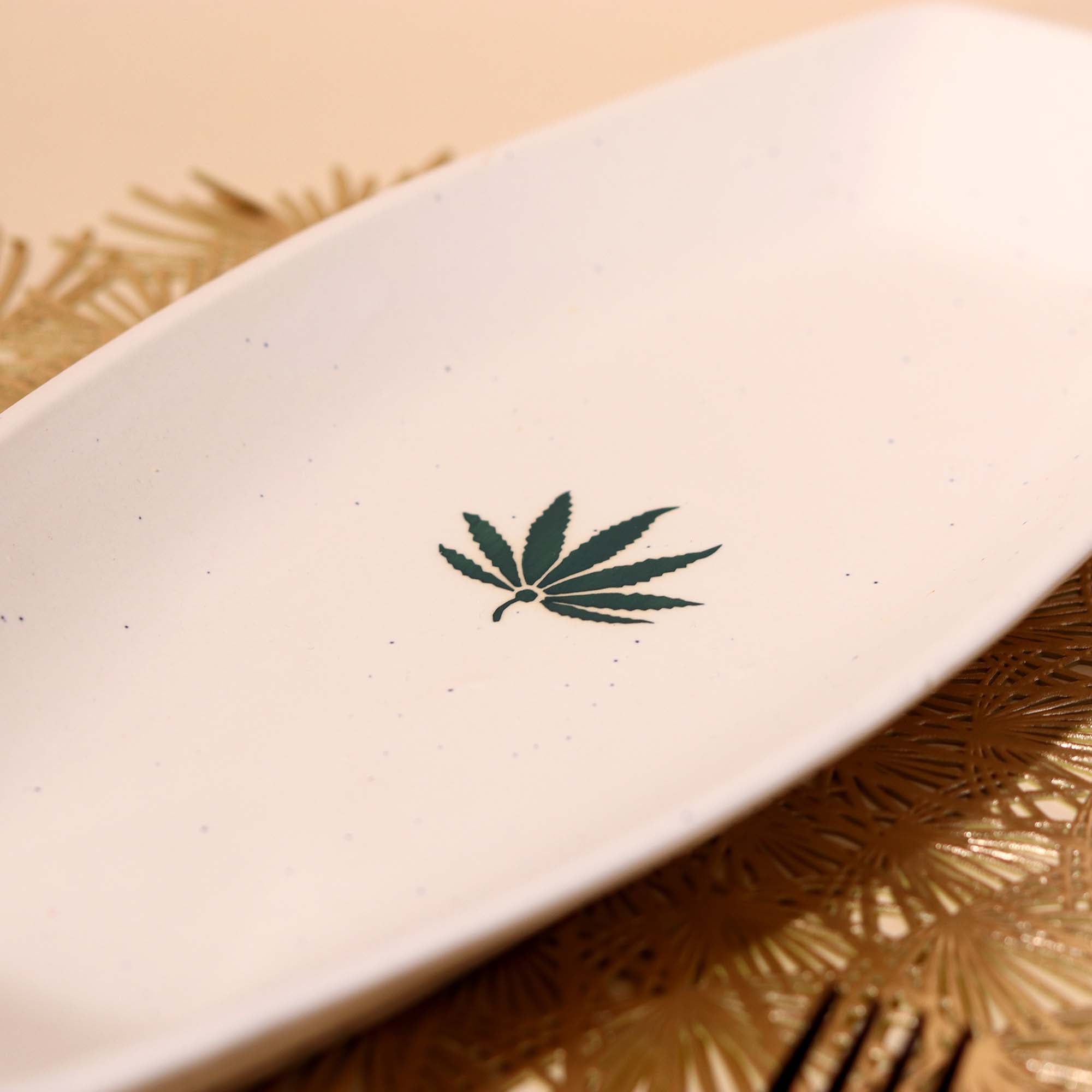 Decorative white ceramic platter with leaf design

