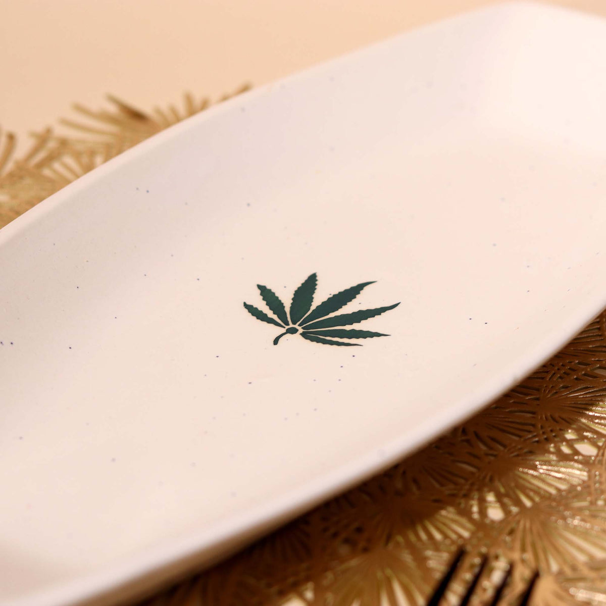 Decorative white ceramic platter with leaf design

