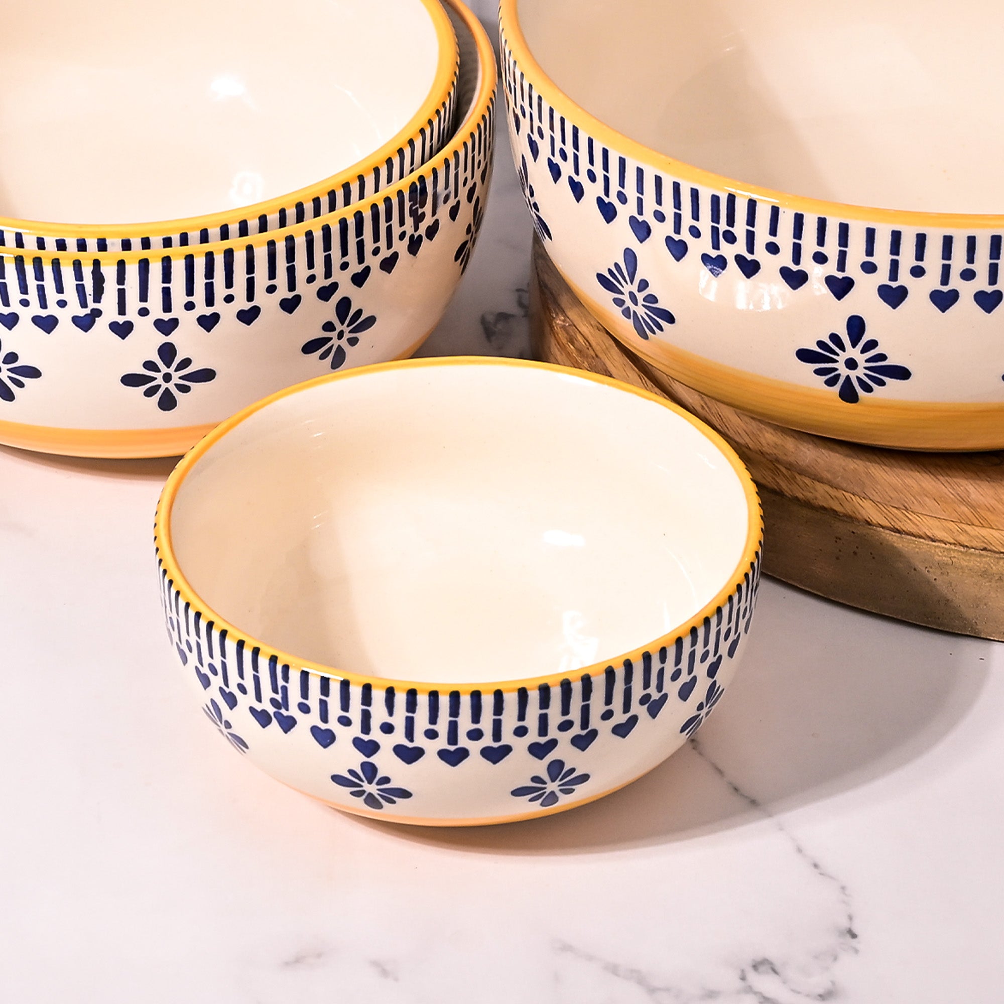 Decorative printed yellow bowls for serving

